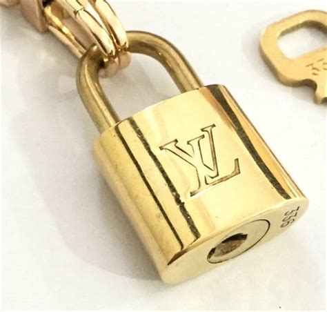 how to spot an authentic louis vuitton padlock|authentic Louis Vuitton lock.